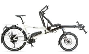 The photo shows a white Pino electric tandem bike on a white background, with a standard saddle at the rear and a semi-recumbent seat in the front.